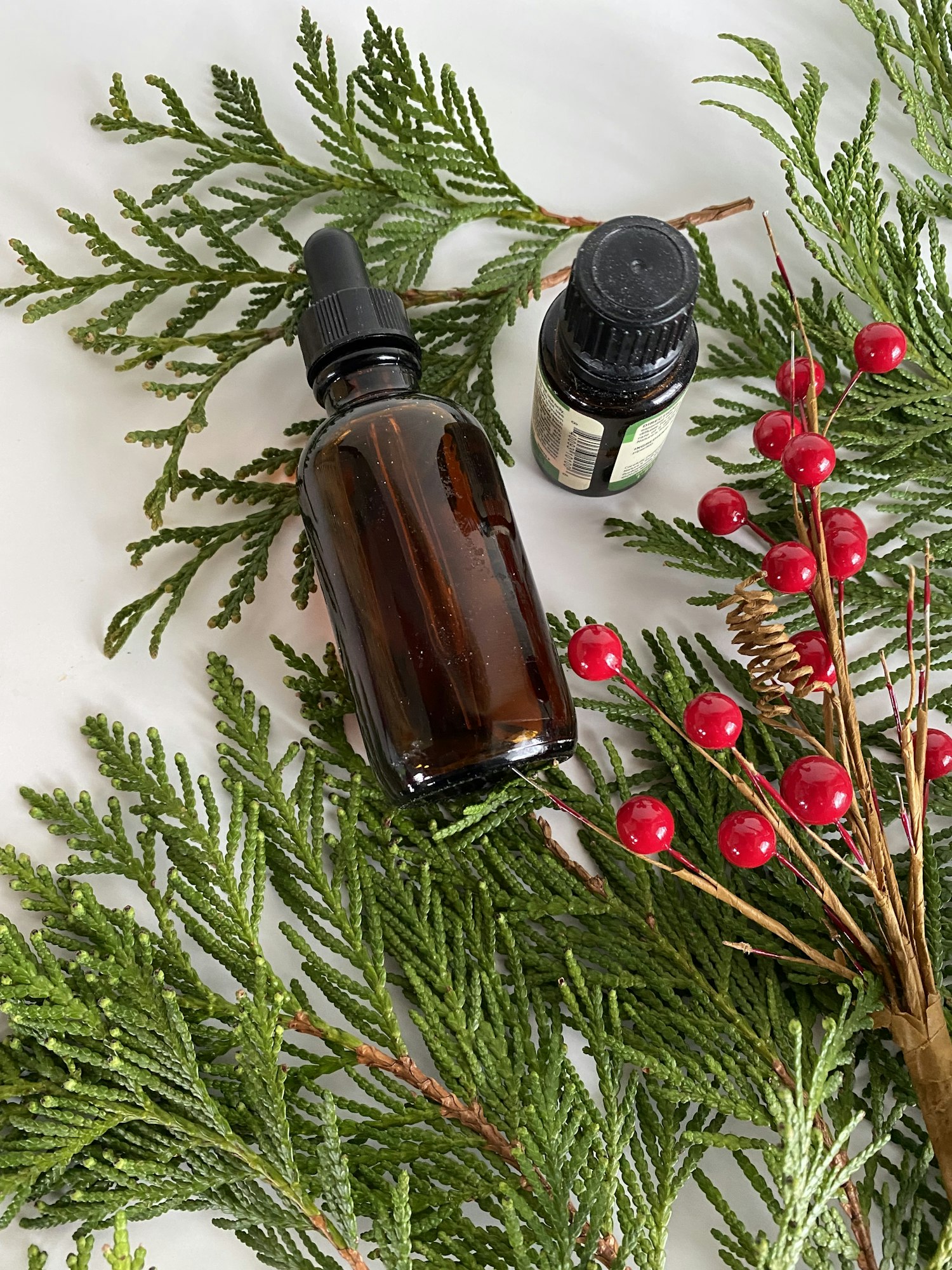 Essential oils on evergreens branches