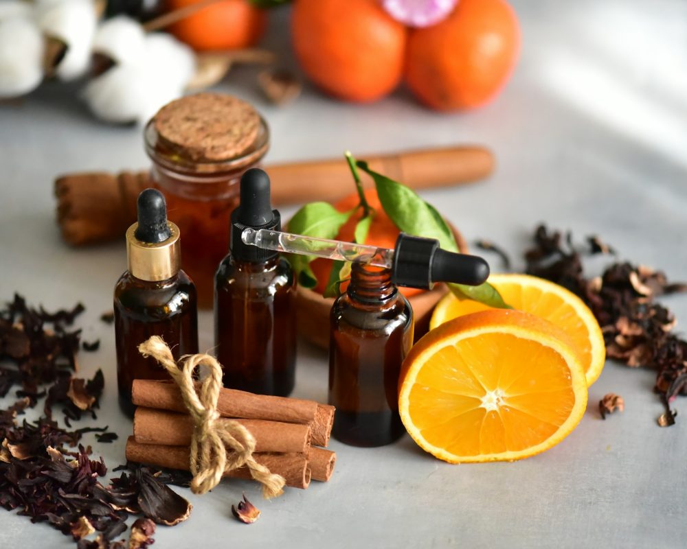 Essential oils with orange on dark bottles